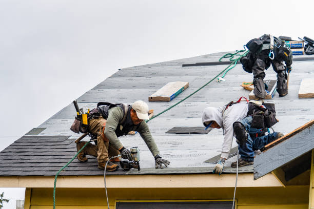 Professional Gutter Installation technician working in Malden, MA